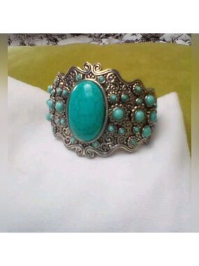 Ladies native style cuff bracelet with Turquoise stones. Perfect condition.